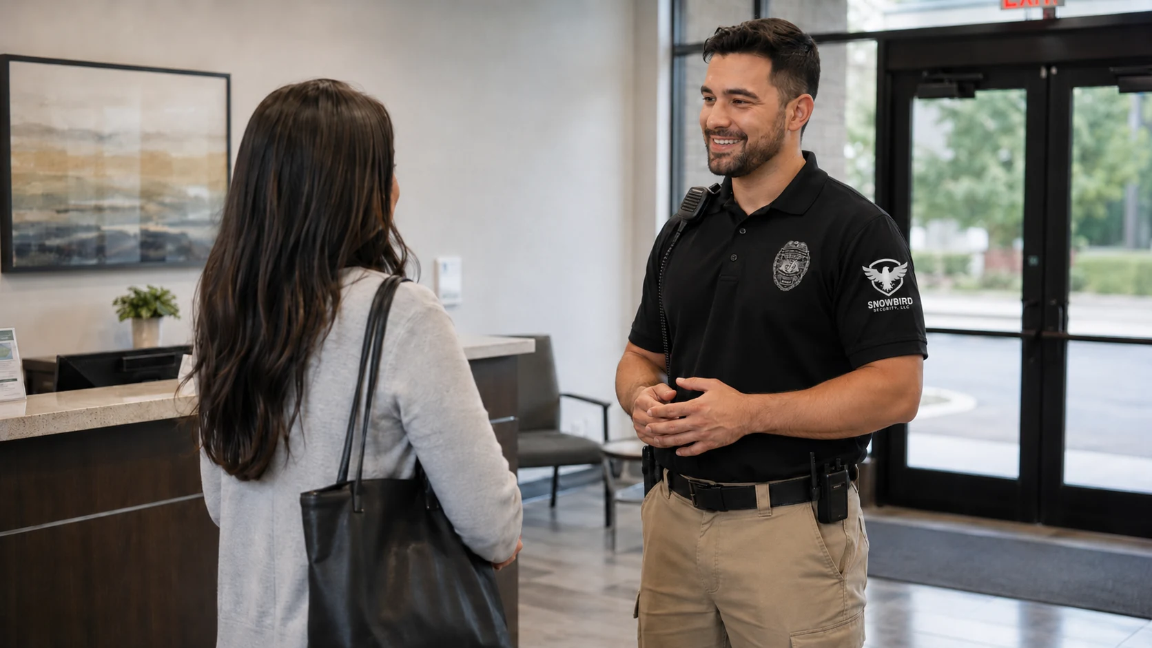 Snowbird Security officer assisting a visitor in a client lobby